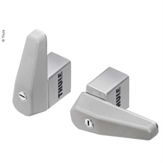 Två Thule-lås med kompakt design och nyckelhål fram. Silverfärgade med "Thule" logo på sidan.